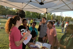 Students at the LEAD Tailgate Party competing in a college trivia contest